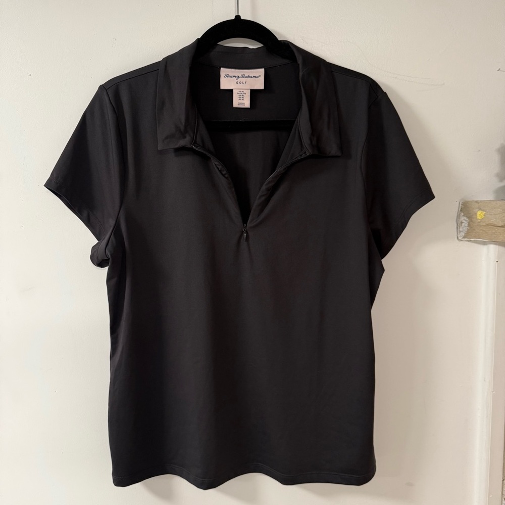 Black zip up polo style short sleeve golf shirt